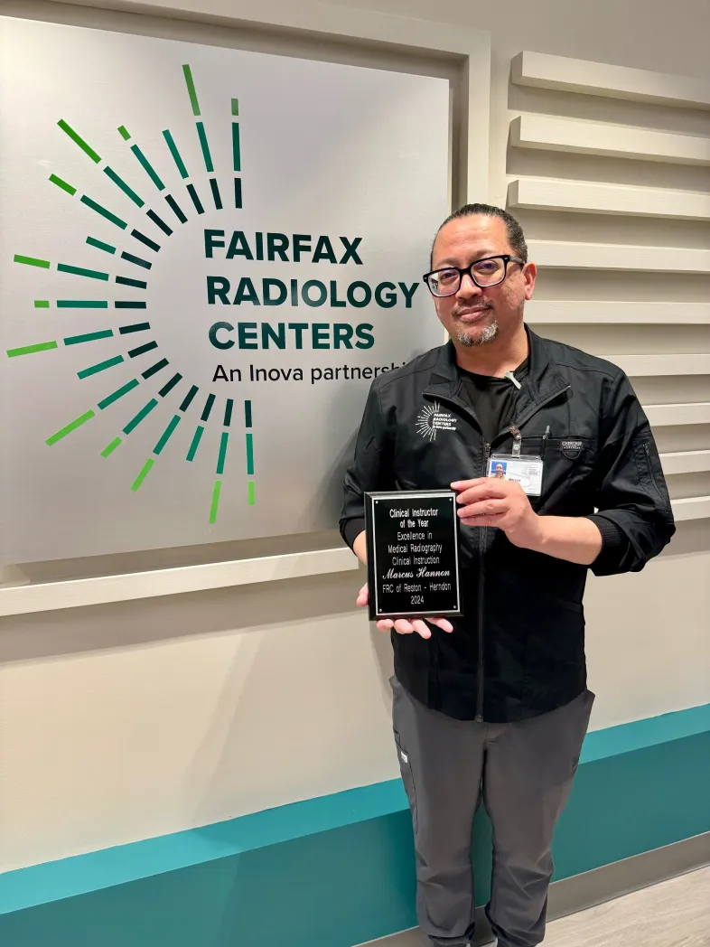 Marcus Hannon holding ECPI award