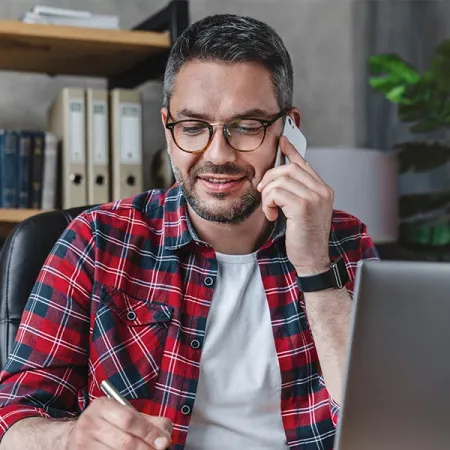 Man paying bill by phone.